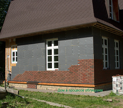 Фото облицовки дома панелями Kombitherm