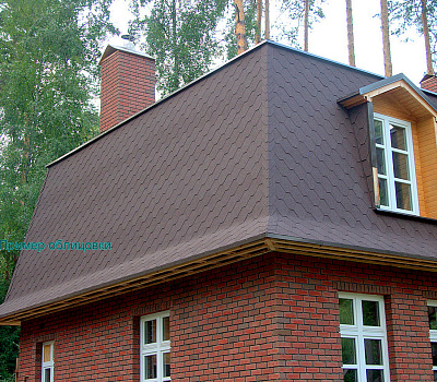 Фото облицовки дома панелями Kombitherm