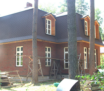 Фото облицовки дома панелями Kombitherm